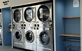 Wash lab Merrylands laundrette with washing machines and dryers plus free detergent and softener and a bench to fold clothes